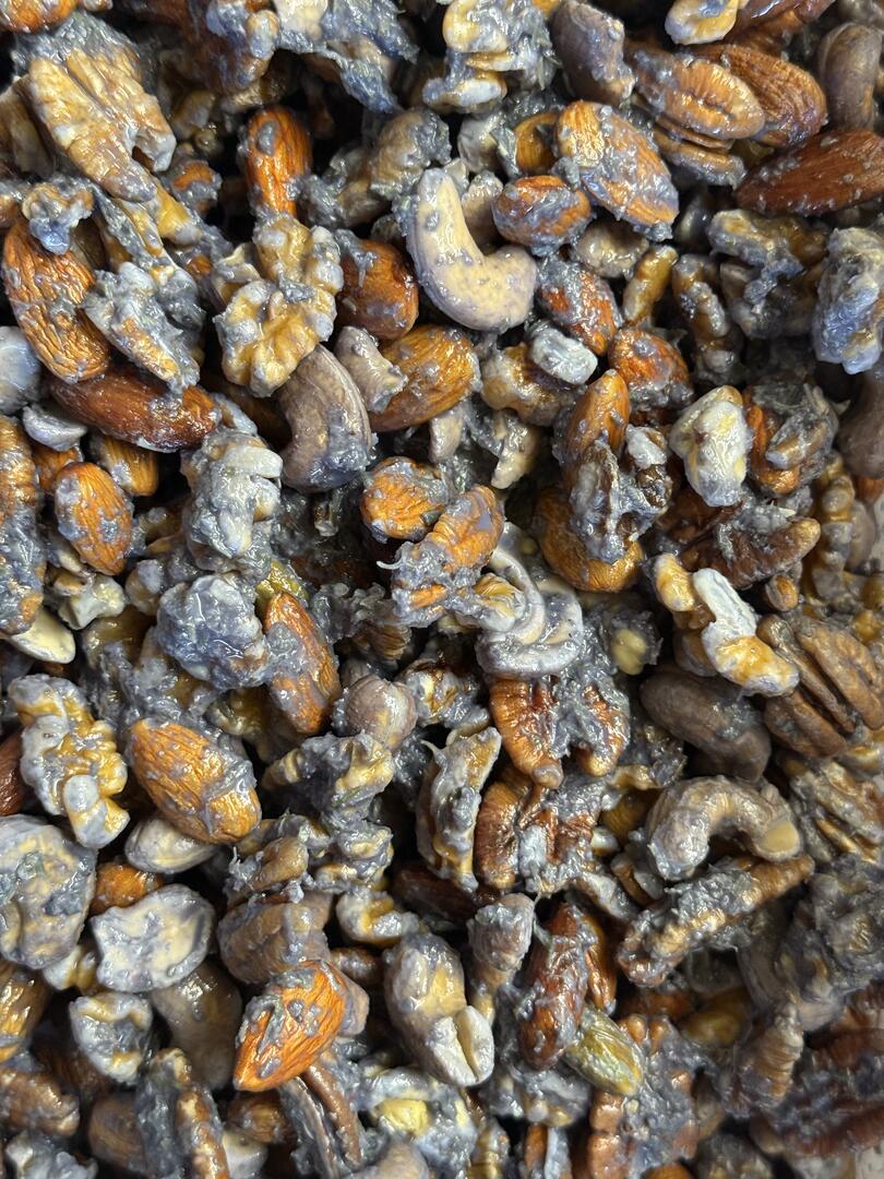 Close up of Butterfly Pea Flower Infused Whole Mixed Nuts here at Eclectus Ark Parrot Treats
